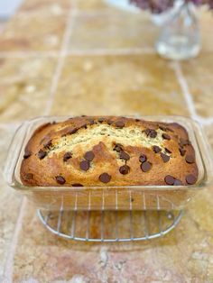 a loaf of chocolate chip bread on a cooling rack