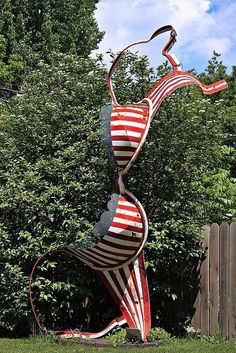 a large metal sculpture in the shape of a woman's body