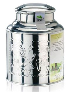 a stainless steel canister with an intricate design