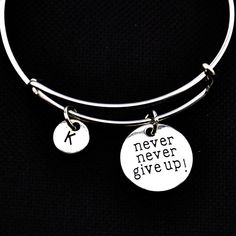 We could all use a bit of inspiration at times. The bracelet is a lovely silver adjustable/expandable bangle bracelet. The  brushed silver pendant says, "never give up". ★You will receive 1 piece ★Material:Alloy ★Please choose initial  from drop down menus. The bracelet is adjustable...perfect to fit most adult wrists. To adjust the bracelet, squeeze to open it more and slide over your hand and wrist, slide the center adjustable section outward to tighten. The lovely clustering of beads/charms in the middle will swish around and give lots of movement.  All of our products are lead and cadmium free, and nickel safe. As they contain small parts, all items are for adult jewelry/craft making use only, not intended for children under the age of 15. Bracelet Tattoo, Tattoo Cover Up Ideas, Cover Up Ideas, Expandable Bangle Bracelet, Tattoo Bracelet, Awesome Tattoo, Tattoo Cover Up, Tattoo Cover-up, Tattoo Cover