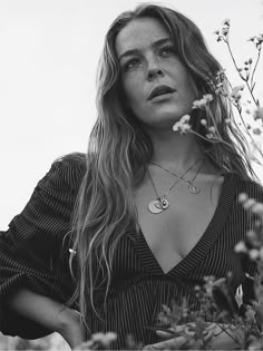 black and white photograph of a woman with flowers