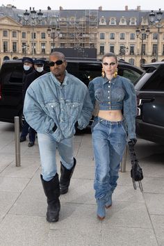 a man and woman walking down the street