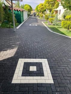 an empty street with a white square in the middle