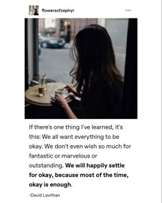 a woman sitting at a table in front of a window with the caption if there's one thing i've learned, it's this we want everything to be okay