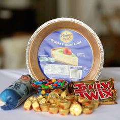 an assortment of candy and crackers on a table