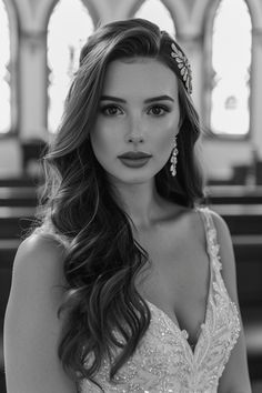 black and white photo of a woman in a church wearing a tiara with long hair