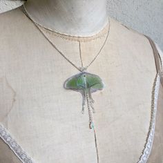 I'm obsessed by Luna moths and Opal stones. This is a delicate and dainty creation, that celebrate my love for them <3 The silk organza butterfly measure about 6 cm wingspan. Silver Plated 925 chain is available in 40 cm (16 inches), 45 cm (18 inches) or more, you can choose! Closed with lobster clasp. Nickel free. The pendant is a natural raw polished Ethiopian Welo Opal that measures about 6 x 4 mm and is attached with structural adhesive. Every opal stone used is unique, nearly transparent Organza Butterfly, Luna Moths, Moth Necklace, Luna Moth, Silk Organza, Necklace Boho, Welo Opal, Opal Necklace, Dainty Necklace