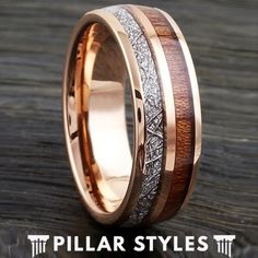 a wedding ring with wood and silver inlays