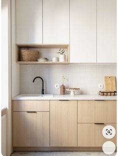 a kitchen with wooden cabinets and white counter tops is featured in the article's magazine