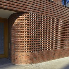 a red brick building with an arched doorway