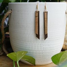 Metallic speckled cork adds a touch of sparkle to these layered cork and leather earrings. Total dangle length: 3.5" Maximum width: 0.25" Diy Earrings Leather Ideas, Everyday Handmade Leather Earrings, Leather Earrings Ideas, Leather Strip Earrings, Cork Leather Earrings, Cork Screw Earrings, Bohemian Leather Drop Earrings, Layered Earrings, Cork Jewelry