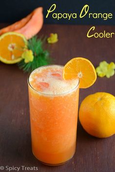 an orange drink is sitting on a table