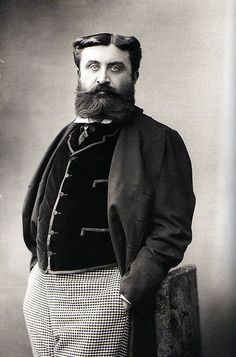 an old black and white photo of a man with a beard