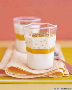 two glasses filled with oatmeal sitting on top of a yellow and white place mat