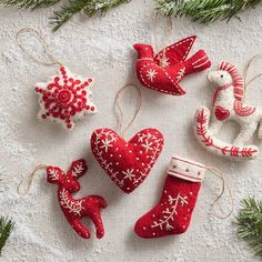 christmas ornaments are arranged on a table