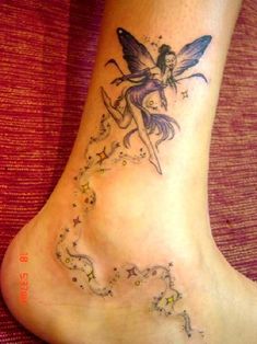 a small fairy tattoo on the foot