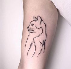 a cat tattoo on the left arm is shown in black and grey ink, it has a line drawing of a cat's head