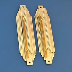 two golden door handles on a blue background