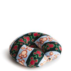 a green and red donut with skulls on it's sides, sitting against a white background