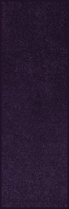 a dark purple carpet with no pattern on it