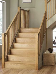 a wooden staircase in a home with hardwood floors