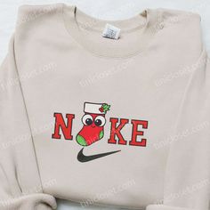 Get in the festive spirit with our Stocking Christmas x Nike Christmas Embroidered Sweatshirt and Shirt! These limited edition pieces are the perfect gift for any Nike lover this holiday season. Made from high-quality materials, they are designed to keep you cozy and stylish during the winter months. The sweatshirt and shirt feature beautiful Christmas-themed embroidery, including stockings, snowflakes, and reindeer, adding a touch of holiday cheer to your outfit. With their comfortable fit and Nike Christmas, Nike Embroidered Sweatshirt, Nike Inspired, Embroidered Apparel, Maroon Hoodie, Gaming Shirt, Hoodie Material, Embroidered Clothes, Embroidered Sweatshirt