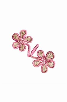 two pink flowers are shown on a white background and one is in the shape of a flower