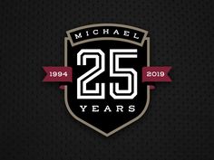 the 25th anniversary logo for michael 25 years, which is on display in front of a black background