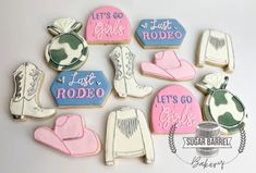 decorated cookies are arranged in the shape of cowboy boots, hats, and mittens