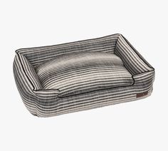 the dog bed is made from fabric and has a striped pattern on it's sides