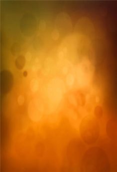 an orange and yellow blurry background with circles