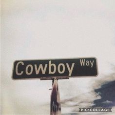 a street sign that reads cowboy way on it's pole in front of a cloudy sky