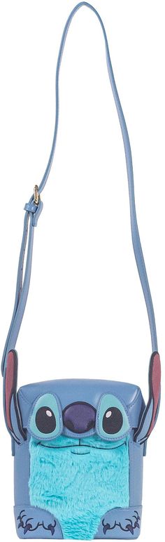 a blue purse with an animal face on the front and shoulder strap, attached to it