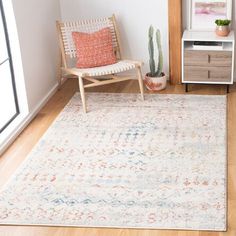 a living room with a chair and rug