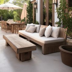 a wooden bench sitting on top of a patio