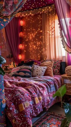 a bedroom with pink curtains and lights on the ceiling, bed covered in colorful bedspreads