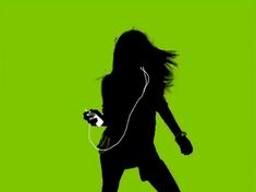 the silhouette of a woman with headphones is shown against a bright green background,