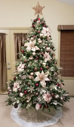 a decorated christmas tree in a living room