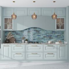 a kitchen with white cabinets and blue tile backsplash, gold trimmings