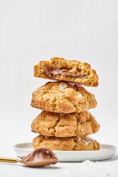 a stack of cookies sitting on top of a white plate