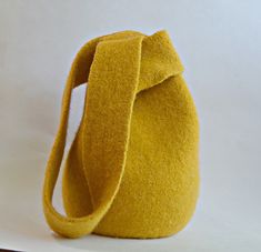 a yellow purse sitting on top of a table