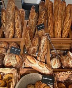 many different types of bread in baskets