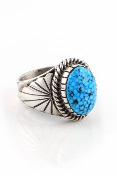 This Kingman Turquoise Men's Ring is completely hand made by a Navajo artist. An exquisite oval of Arizona Kingman Turquoise is bezel set and encircled with a sterling silver rope. The gleaming sterling silver shank has a hand cut sterling silver fan design on each side of the stone. It's a little masterpiece you'll be proud to own. Hallmarked BV and Stamped "Sterling". Mens Turquoise Rings, Turquoise Men, Mens Ring Sizes, Navajo Rings, Fan Design, Navajo Jewelry, Silver Eagles, Native Jewelry, Turquoise Rings