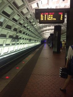 people are waiting for the subway to arrive