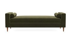 an upholstered green couch with wooden legs and arm rests on a white background