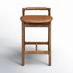 a wooden chair with brown leather seat and back rest on an isolated white background for display or montage