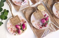 four tea bags with flowers on them