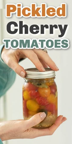 pickled cherry tomatoes in a jar with text overlay that reads pickled cherry tomatoes