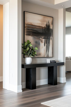 40+ Modern Console Table Designs for Minimalist Homes Black And White Entryway Table, Minimalistic Console Table, Entryway Ideas Hallway, Small Foyer Ideas Entryway Modern Luxury, Small Foyer Ideas Entryway Modern, Console Table Hallway Entrance Halls, Foyer Ideas Entryway Modern, Entrance Way Decor, Entries Ideas