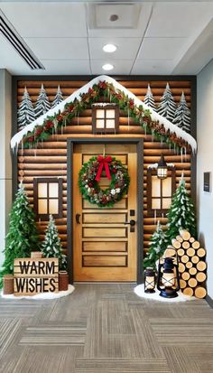 an office decorated for christmas with wreaths, pine trees and decorations on the front door